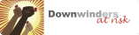 Logo for Downwinders at Risk featuring three raised fists of different skin tones holding red inhalers on the left, with the words “Downwinders at risk” on the right — “Downwinders” in bold gray and “at risk” in red script.